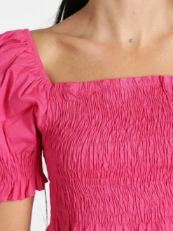 Lumina Top crop con manica a sbuffo